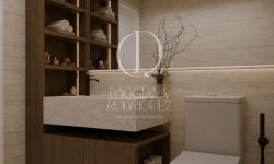Diseño de baño moderno con tonos crema y muebles suspendidos